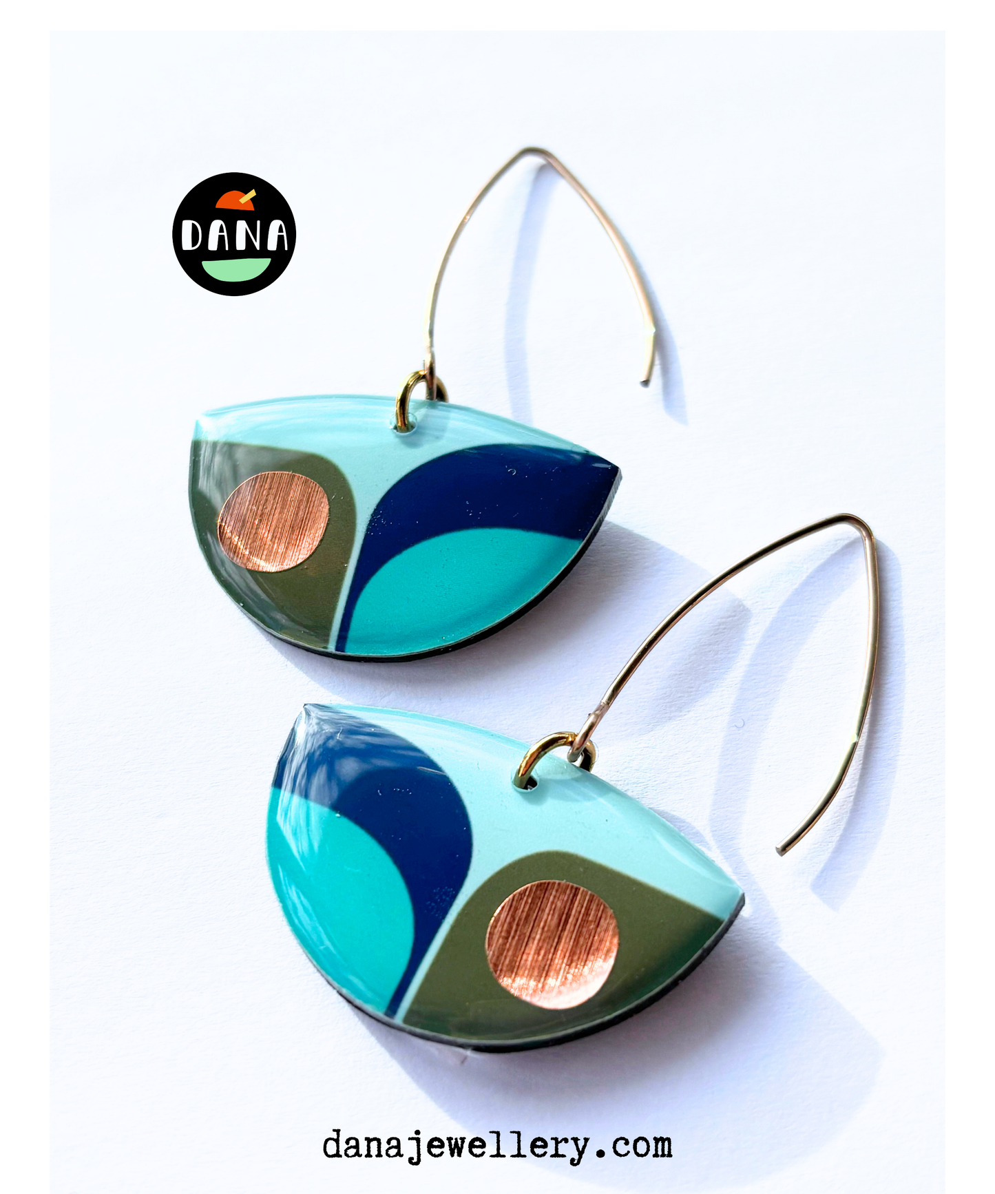 BEA in navy blue, olive green, light teal with a warm pop of copper