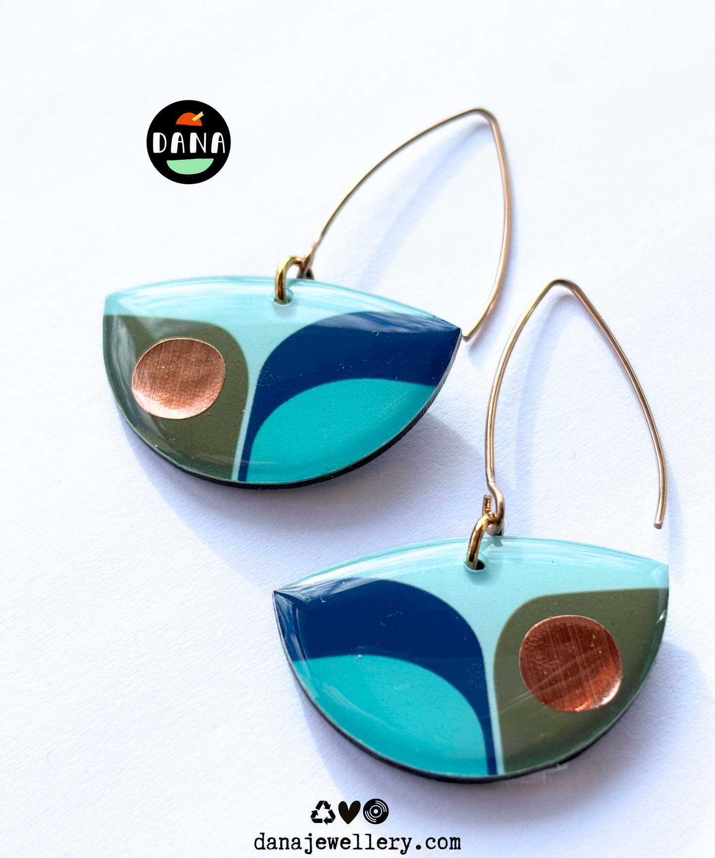BEA in navy blue, olive green, light teal with a warm pop of copper