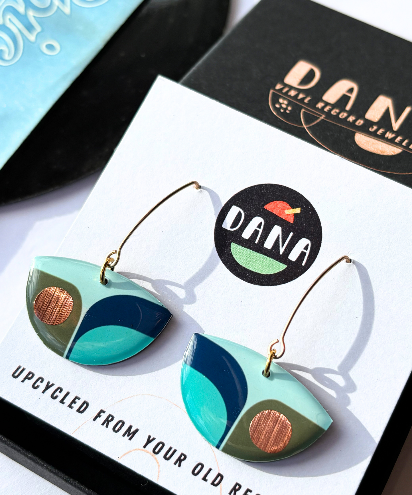 BEA in navy blue, olive green, light teal with a warm pop of copper