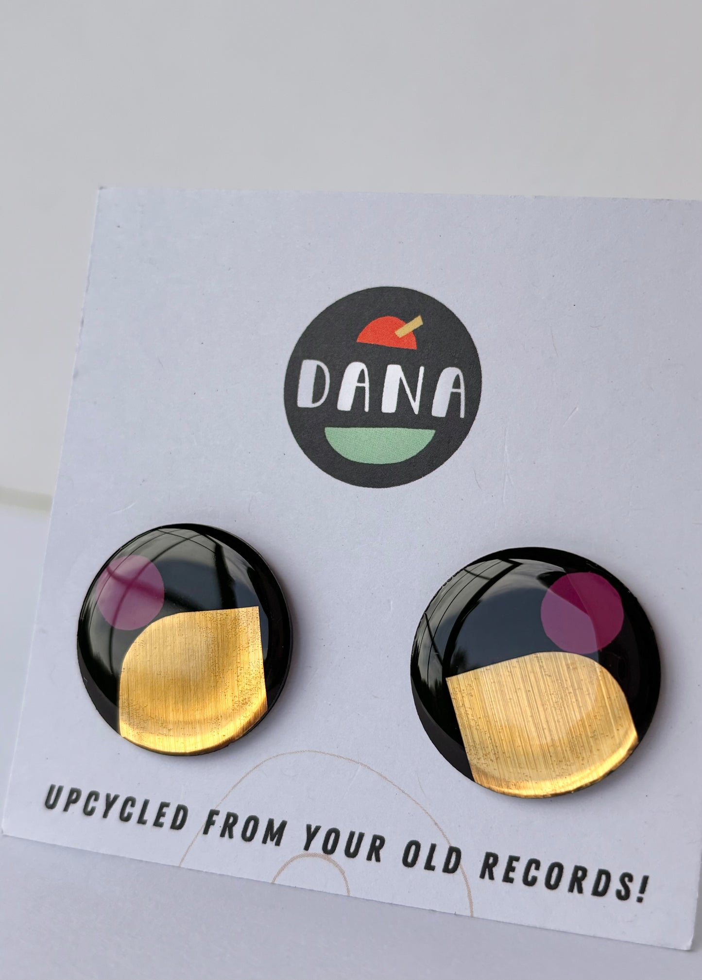 40% off large upcycled vinyl record studs in black, gold, and purple