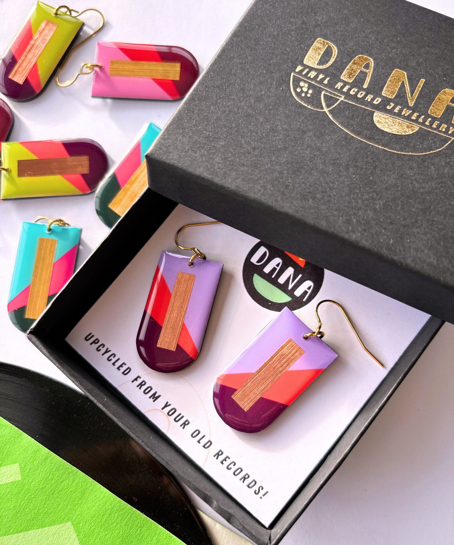 NINA in lilac, deep orange, plum, and copper